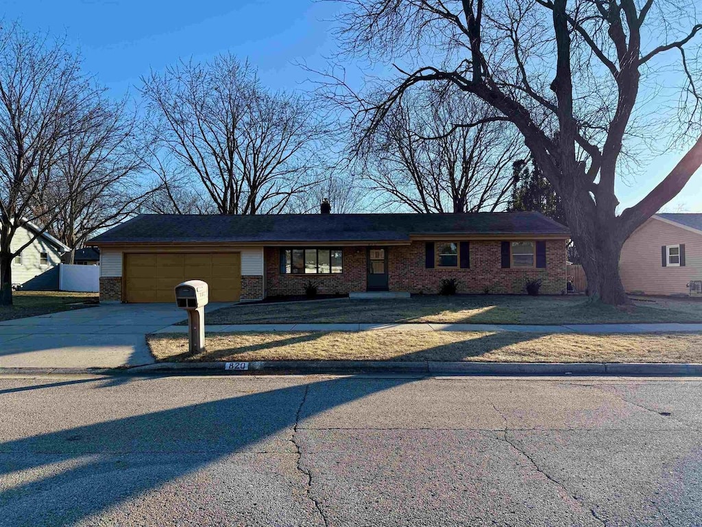 single story home featuring a garage