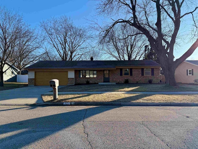 single story home featuring a garage