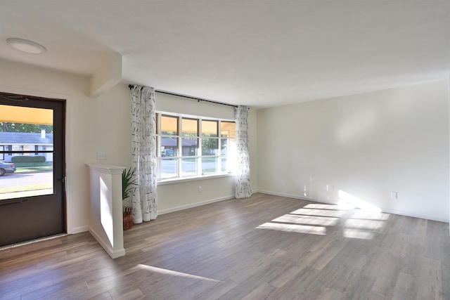 unfurnished living room featuring light hardwood / wood-style flooring