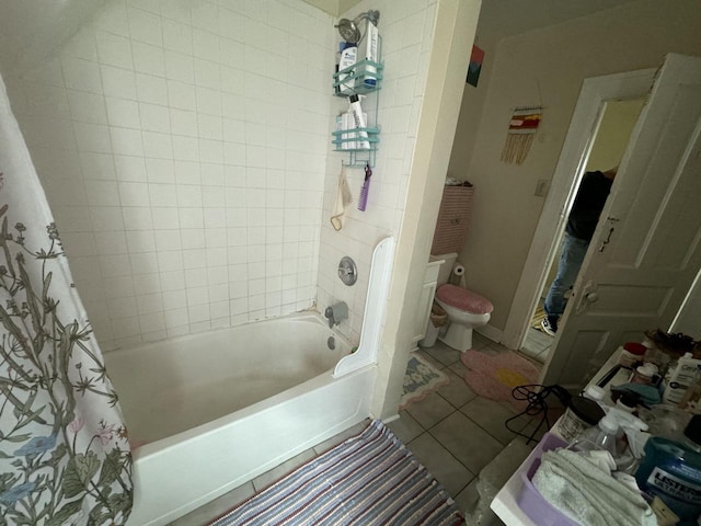 bathroom with toilet, shower / bath combination with curtain, and tile patterned flooring