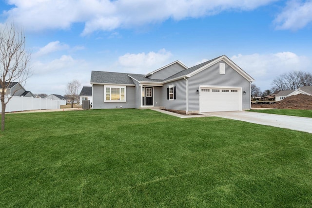 view of front of house featuring a front yard and a garage