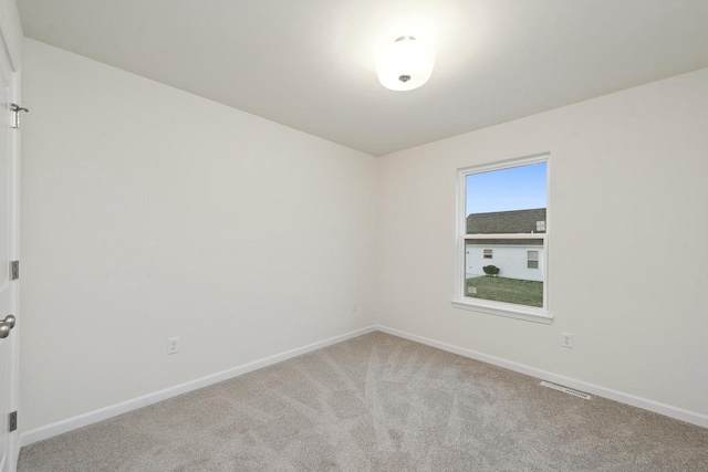 spare room featuring carpet flooring