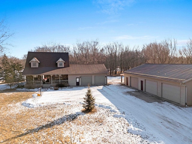 view of front of property with a garage and covered porch