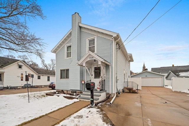 view of front property with a garage and an outdoor structure