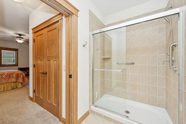 bathroom featuring a shower with door