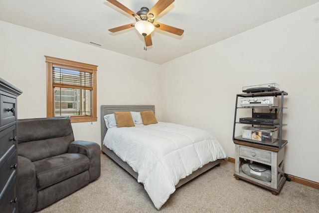 bedroom featuring ceiling fan and light colored carpet