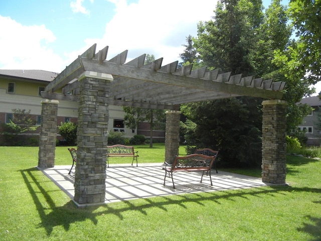 view of community featuring a patio area, a lawn, and a pergola