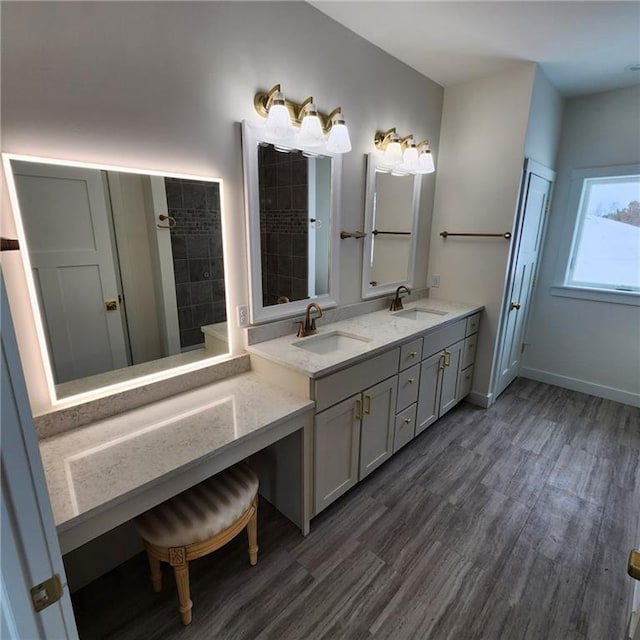 bathroom with hardwood / wood-style floors and vanity