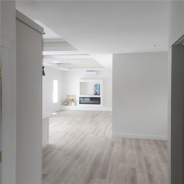 unfurnished living room featuring light hardwood / wood-style floors