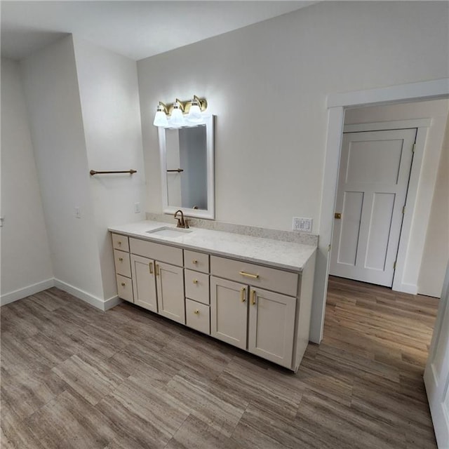 bathroom with vanity and hardwood / wood-style floors