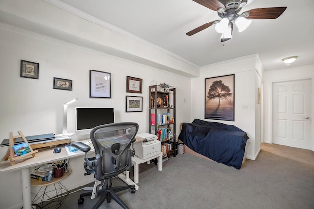 carpeted home office with ornamental molding and ceiling fan