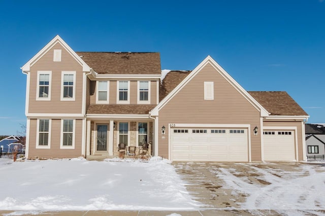 view of front of property with a garage and a porch