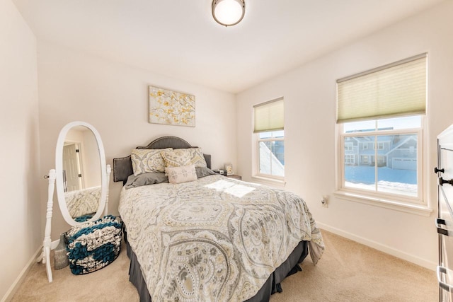 bedroom featuring light carpet