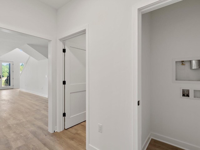 corridor with light hardwood / wood-style flooring