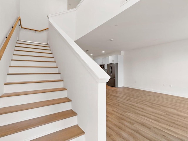 stairway featuring hardwood / wood-style floors