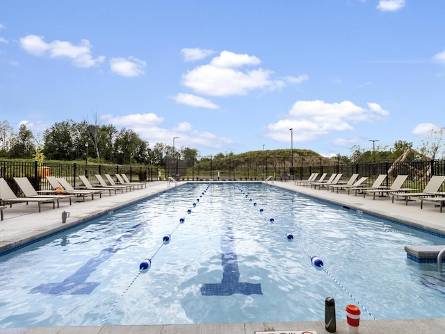 view of swimming pool featuring a patio area