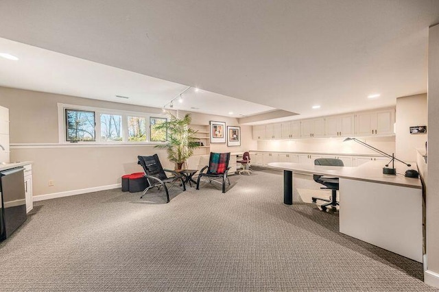 office area with track lighting and carpet flooring