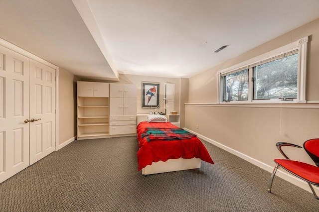 bedroom with dark carpet