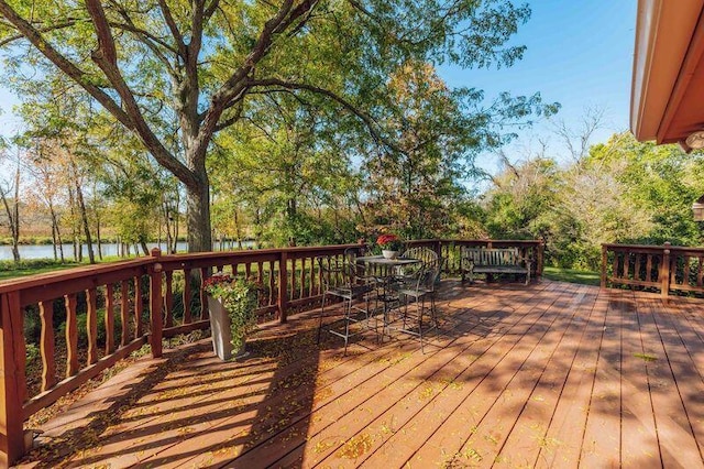 wooden terrace with a water view