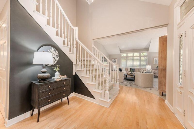 staircase featuring wood-type flooring