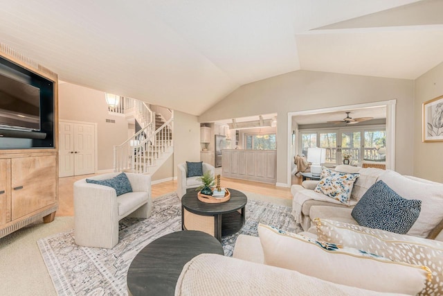 living room featuring lofted ceiling