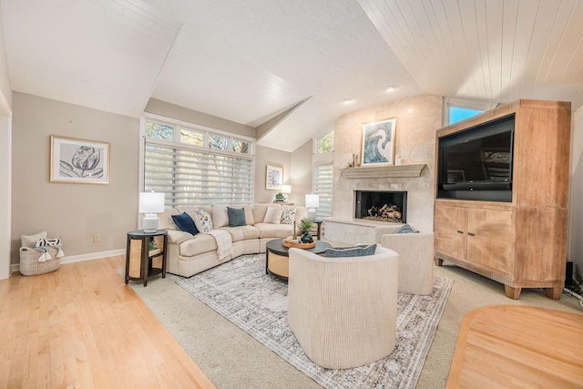 living room with hardwood / wood-style floors, vaulted ceiling, and wooden ceiling