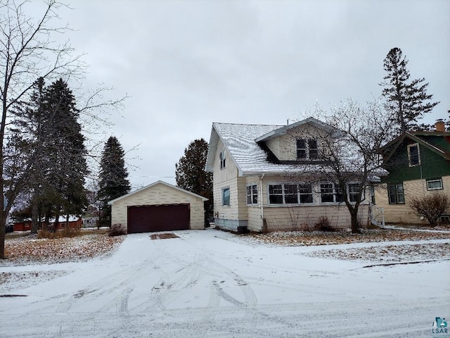 view of front facade with a garage and an outdoor structure