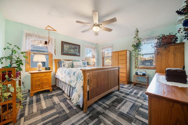 carpeted bedroom with ceiling fan