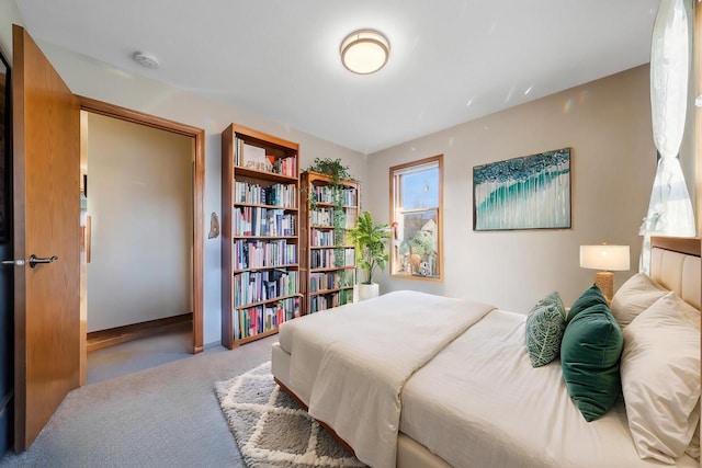 bedroom with light colored carpet