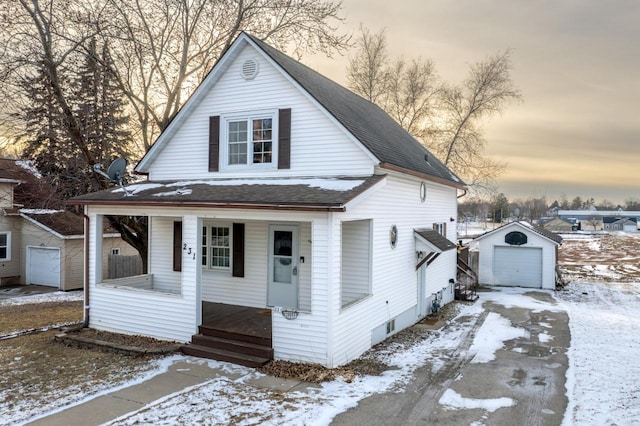 bungalow-style home featuring a porch and a shed