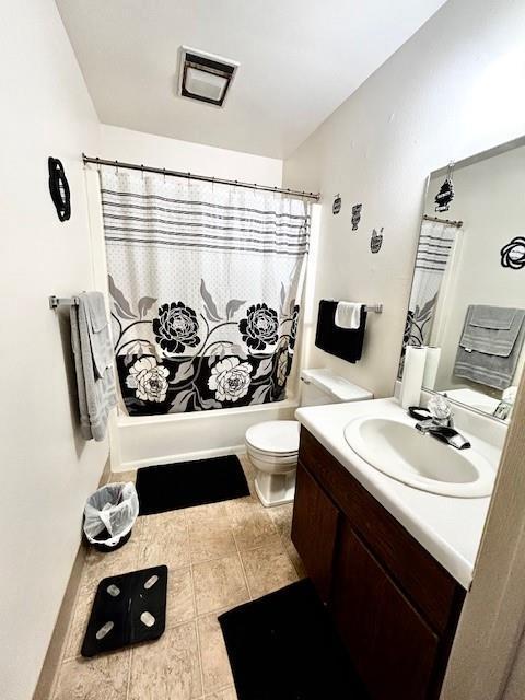 full bathroom featuring toilet, vanity, and shower / bath combo