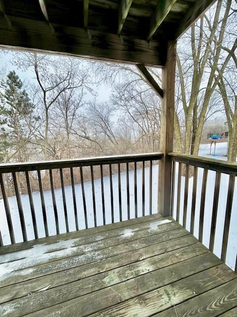 view of snow covered deck