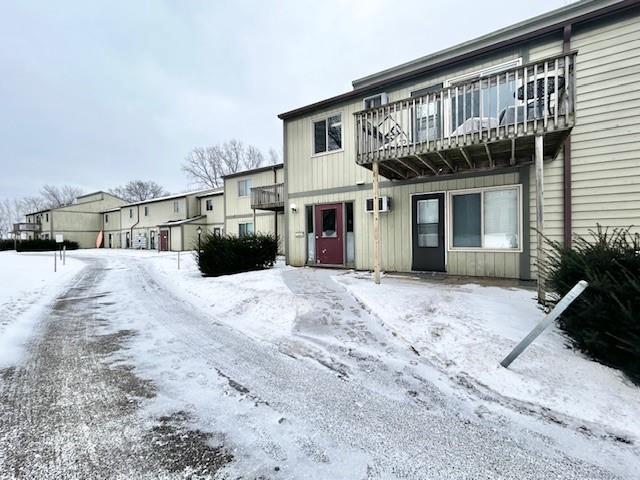 view of front of home with a balcony