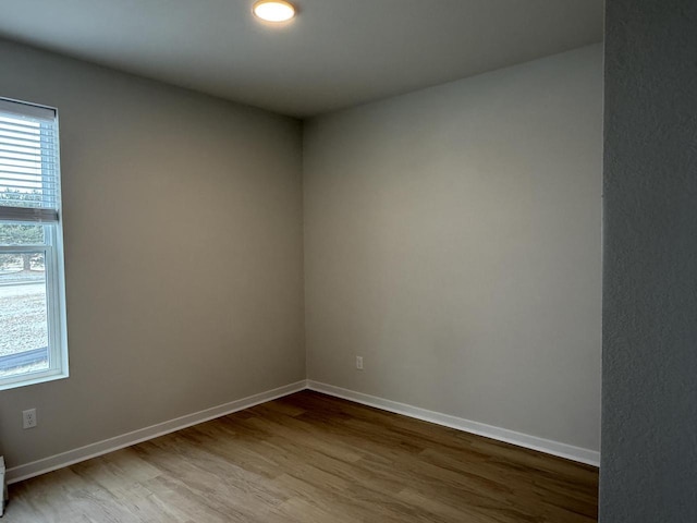 unfurnished room featuring hardwood / wood-style floors