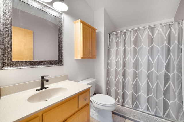 bathroom with vanity, toilet, walk in shower, and tile patterned flooring