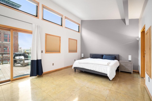 bedroom with a high ceiling and beamed ceiling