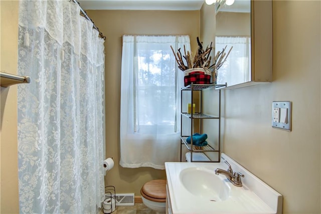 bathroom featuring sink and toilet