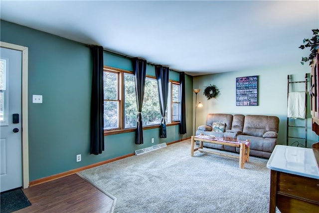 living room with dark carpet