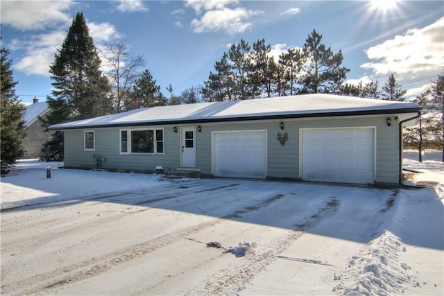 ranch-style home featuring a garage