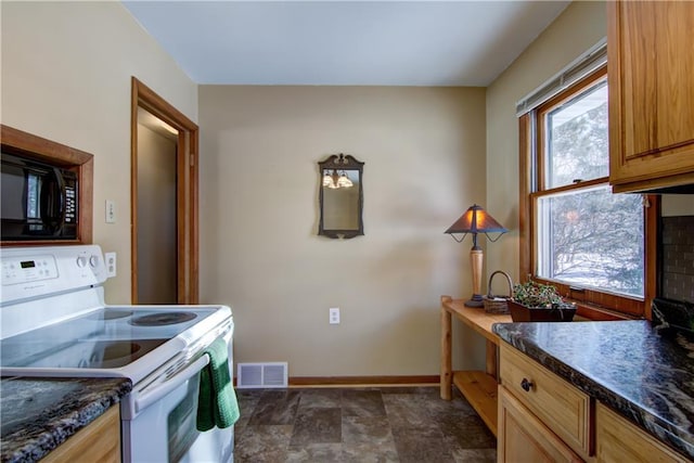 kitchen featuring white electric range oven