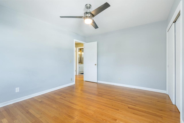 unfurnished bedroom with a closet, ceiling fan, and light wood-type flooring