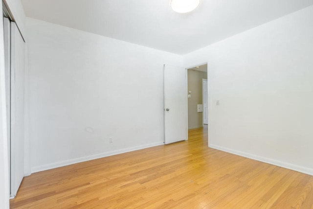 spare room featuring light hardwood / wood-style flooring