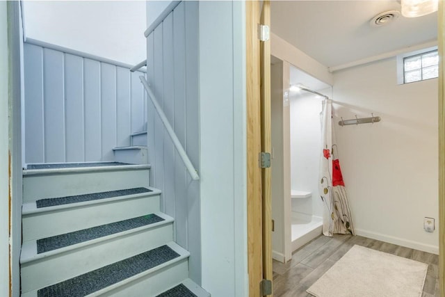 stairway featuring hardwood / wood-style flooring