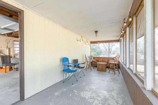 unfurnished sunroom featuring plenty of natural light