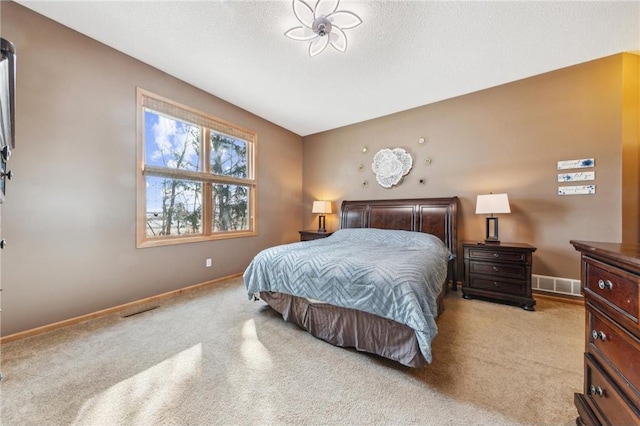 carpeted bedroom with a textured ceiling