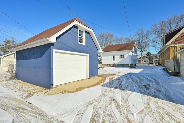 view of snow covered garage