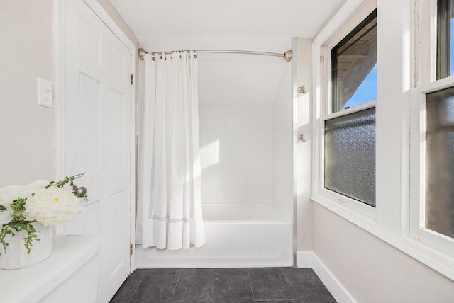 bathroom with shower / bath combo