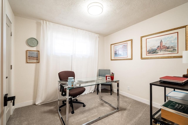 office featuring a textured ceiling and carpet flooring