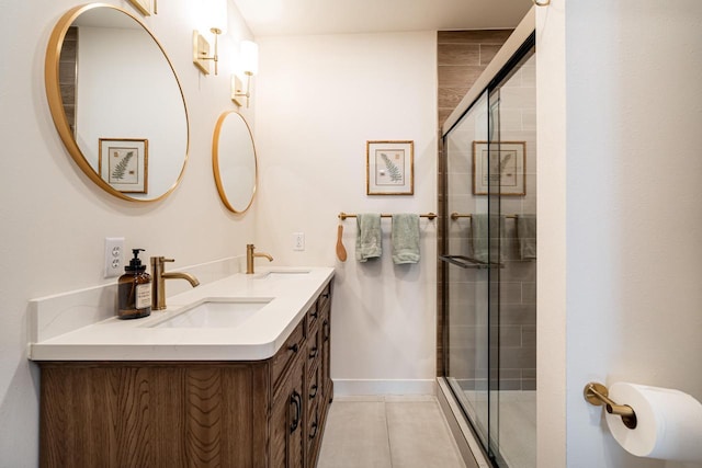 bathroom featuring vanity, walk in shower, and tile patterned flooring