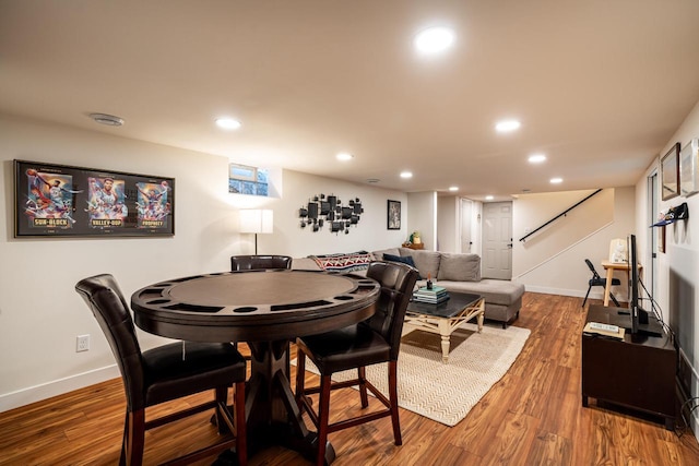 dining area with dark hardwood / wood-style flooring